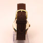 Reloj de pulsera Omega dorado (correa marrón)