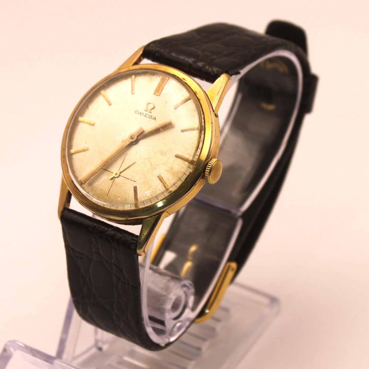 Reloj de pulsera Omega dorado (correa negra)