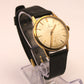 Reloj de pulsera Omega dorado (correa negra)