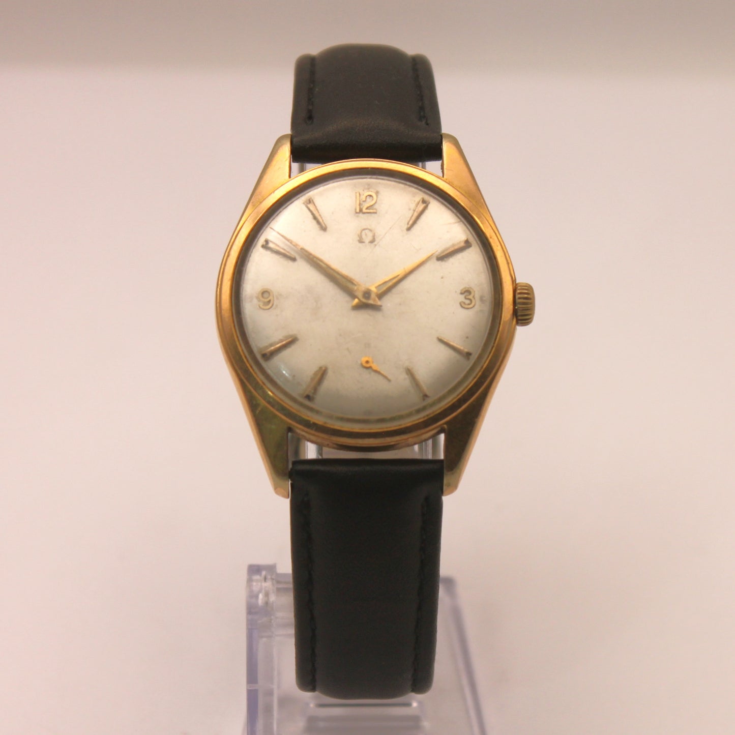 Reloj de pulsera Omega dorado (correa negra)