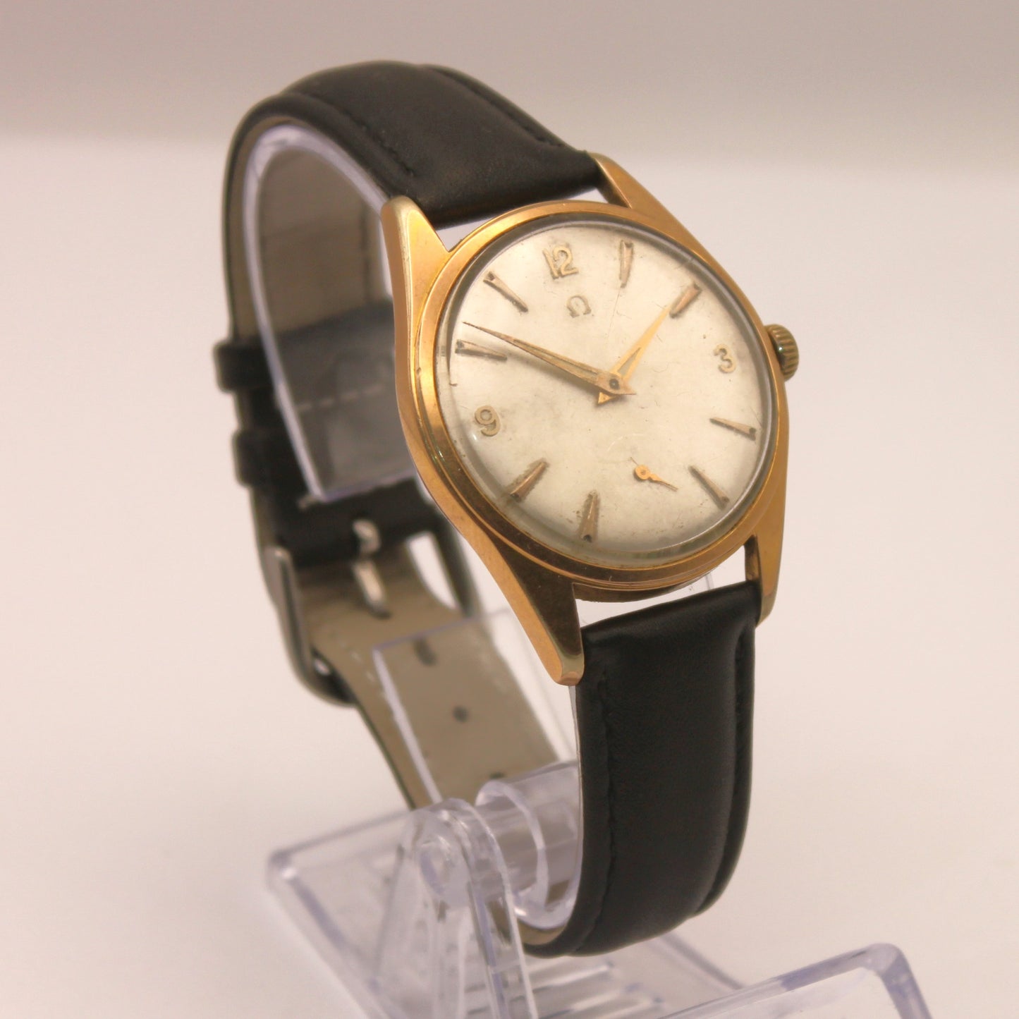 Reloj de pulsera Omega dorado (correa negra)