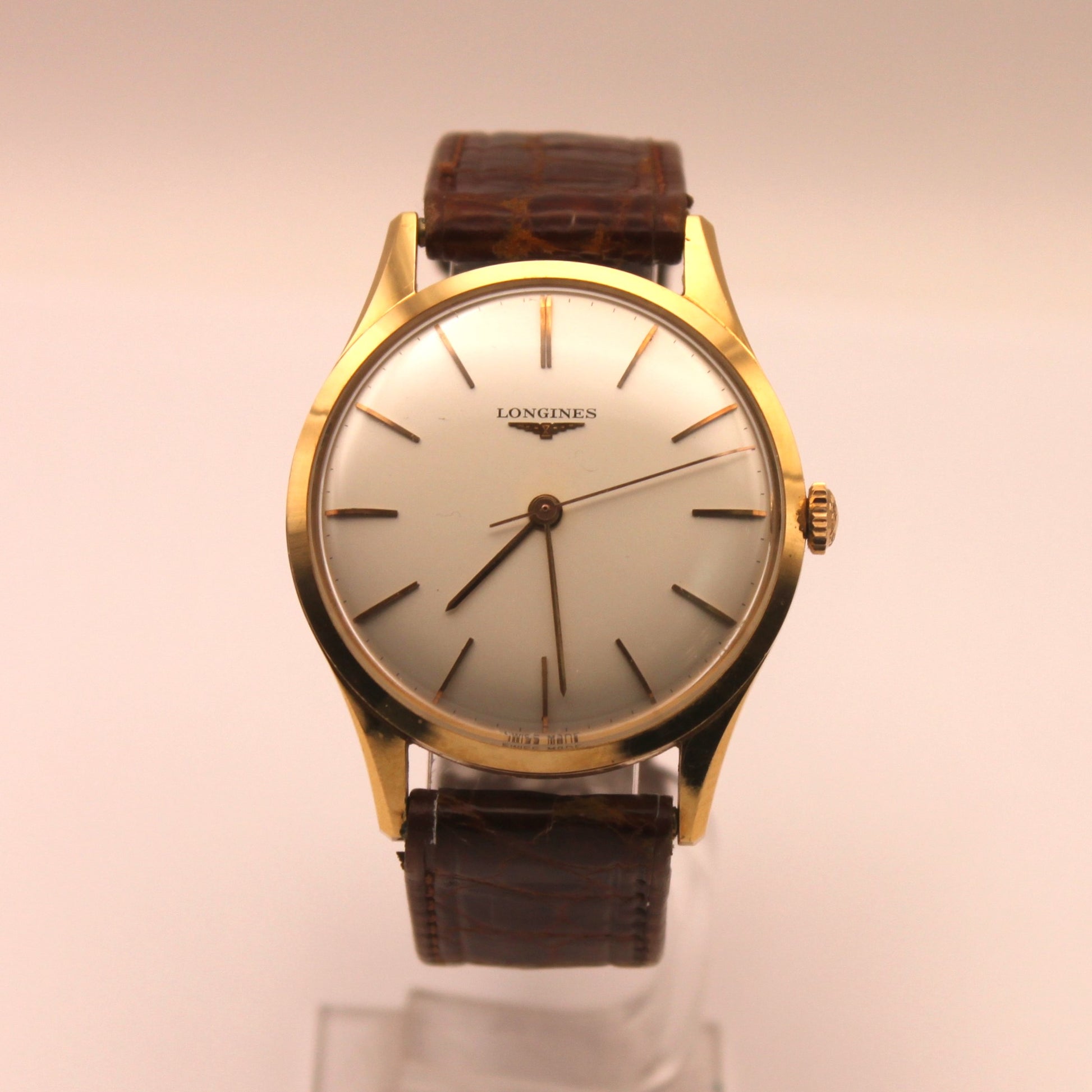 Reloj de pulsera Longines en oro – Jorge Mashini Antigüedades