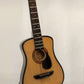 Guitarra acústica a escala