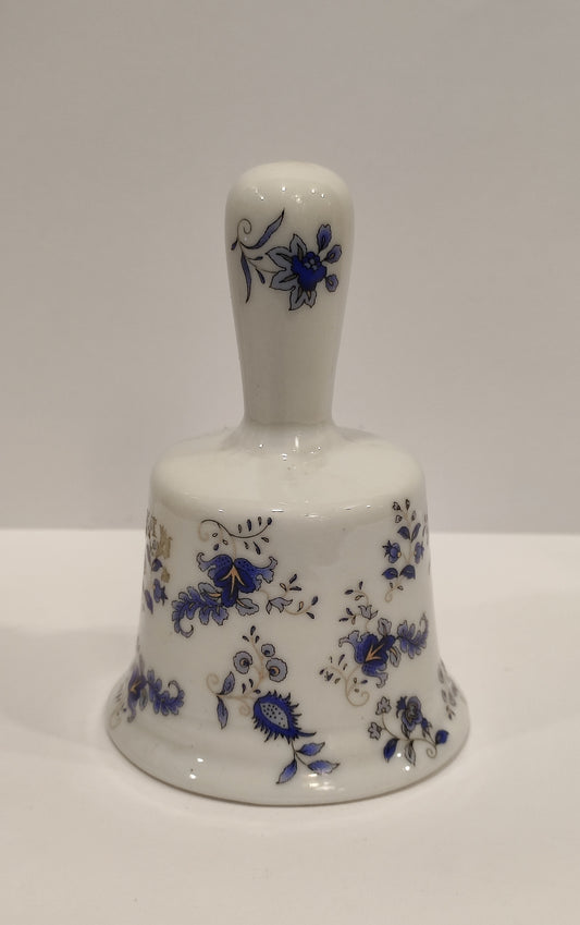 Campanilla de porcelana decorada con flores